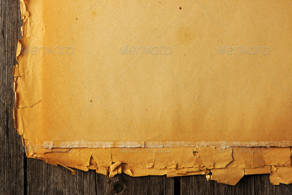 burnt paper on wood background