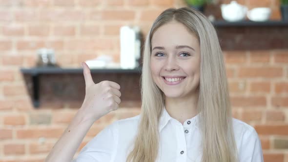 Thumbs Up by Young Woman alt