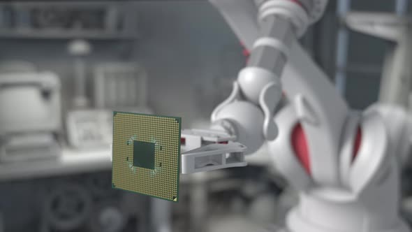 The robot arm holds a modern supercomputer processor.