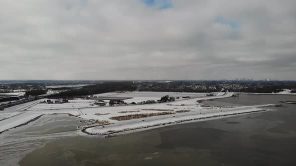 Crezeepolder Nature Reserve With Noord River At Winter In Hendrik-Ido-Ambacht, Netherlands. - aerial alt
