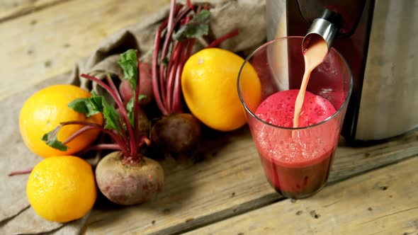 Juice maker pouring juice into glass 4k alt