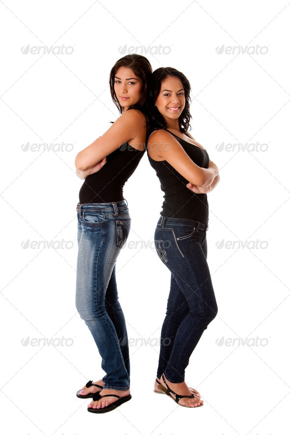 Hppy young girls back to back - Stock Photo - Images