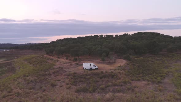 Drone panoramic aerial view of a camper van living vanlife at Minutos Dam in Arraiolos Alentejo alt