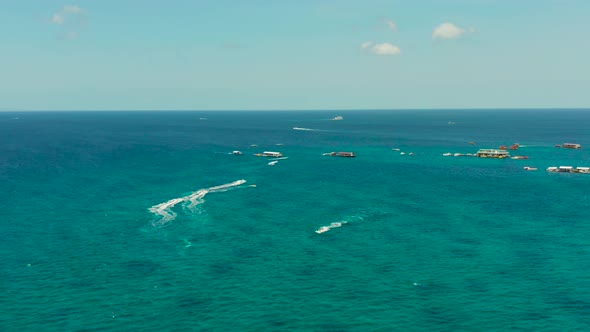 Tourists on a Jet Skis on a Tropical Resort alt