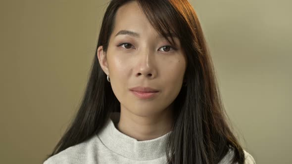 Portrait of a Young Asian Woman with Natural Makeup