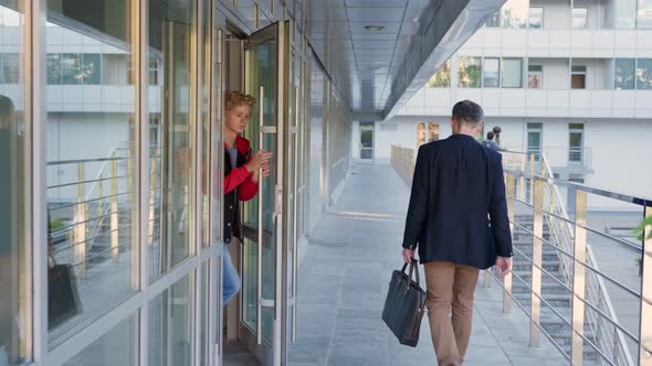 Diverse Teen Schoolchildren Walk Out of Building After Lesson alt