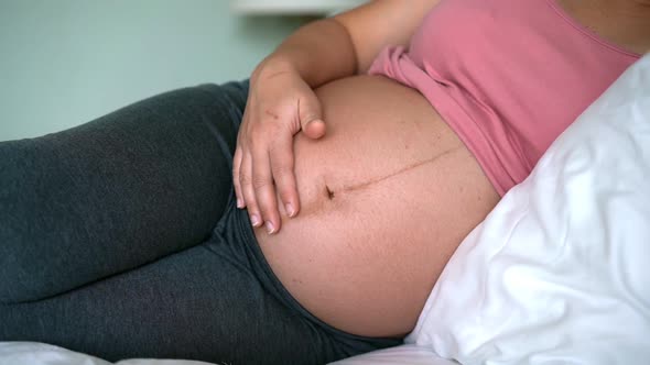 Happy Pregnant Woman and Expecting Baby at Home alt