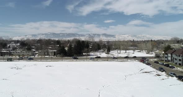 A wide pan shot of the rocky mountains from Fort Collins Colorado showing snowfall March 2021 alt