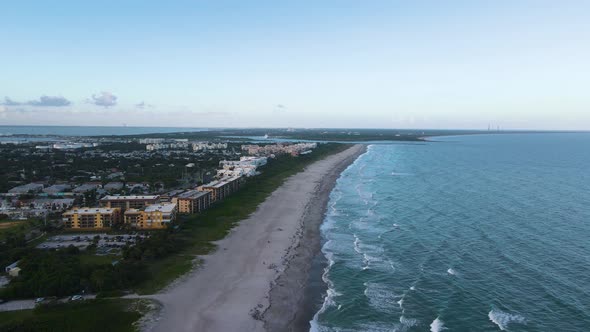 Serene Sunset Scene in Touristic Cocoa Beach, Florida. Aerial Establishing alt