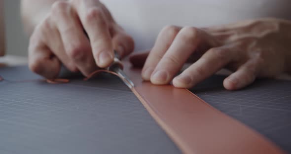 Using Leather Edge Beveler During Belt Manufacturing Process Closeup alt