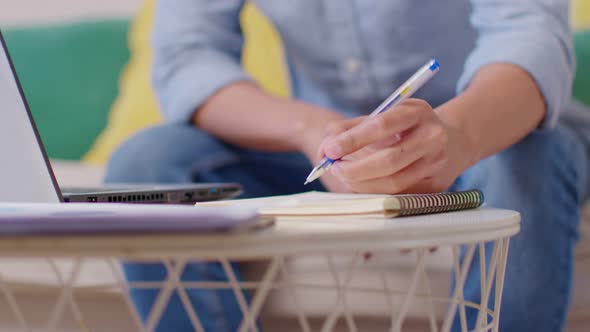 Close up hand of businessman or freelancer writing business plan or customer order to notebook alt