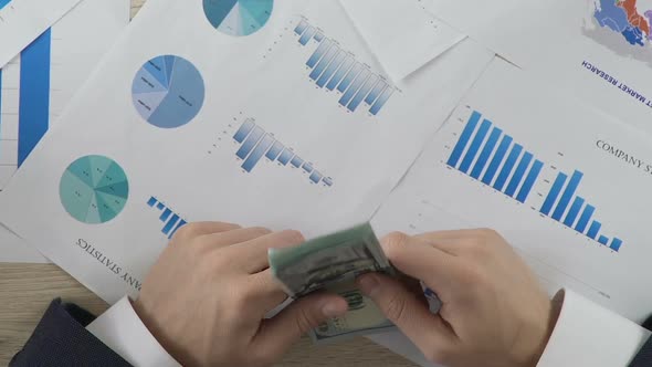 Dishonest Businessperson Giving Bribe to Partner, Corruption and Crime, Top View alt