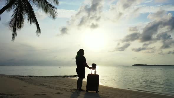 Lady tans on tranquil coastline beach journey by blue water with clean sand background of the Maldiv alt