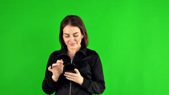 Cute Girl Using Phone Send Text Messages on Green Screen