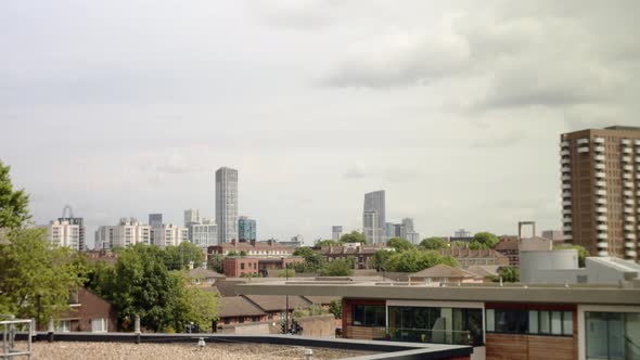 East London skyline with modern skyscrapers. Panorama panning left alt