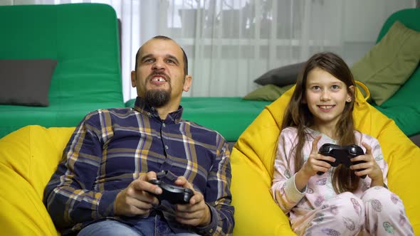 Male Babysitter and Child Having Fun Together at Home alt