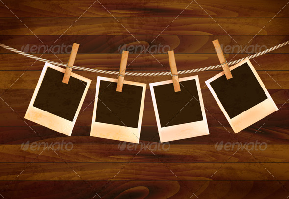 Retro Photos Hanging on a Rope on Dark Wooden Back - Retro Technology