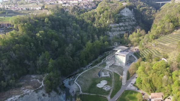 abandoned cement factory monument in the middle of nature drone 4k alt