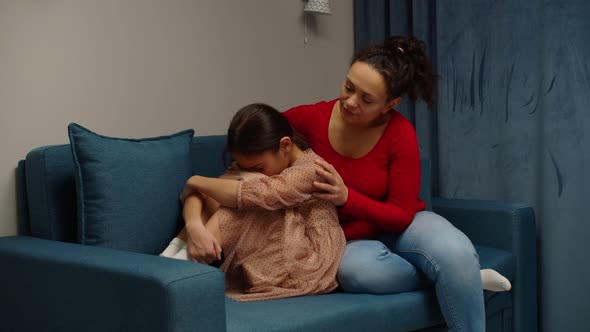 Loving Mother Supporting Upset Preteen Daughter at Home, Stock Footage