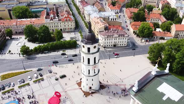Iconic bell tower of Vilnius Cathedral, aerial ascend view alt