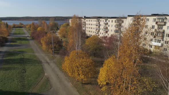 Aerial view of provincial city with soviet panel houses and the alley 29 alt