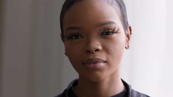 Portrait of Beautiful Young 20s African Girl Woman with Perfect Skin and Makeup with Long Eyelashes alt