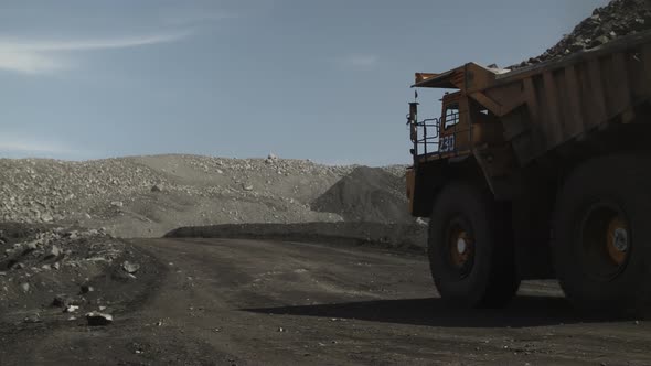 Far Away Going Electric Mining Dump Truck Filled with Coal