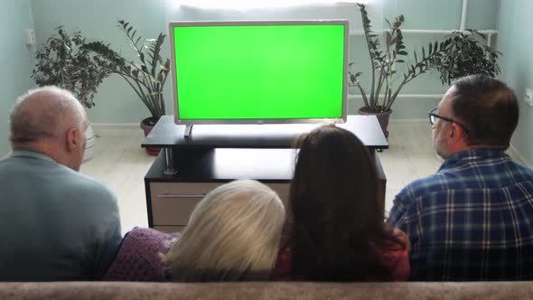 Family Watching TV. Green Screen.