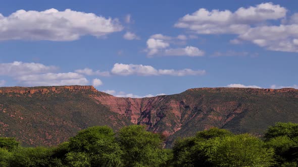 Time Lapse Namibia or cloudsing past a mountain range alt