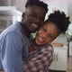 Video of happy african american couple embracing at home