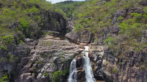 Waterfall tilt down drone clip - Chapada dos Veadeiros, world natural heritage, Brazil alt