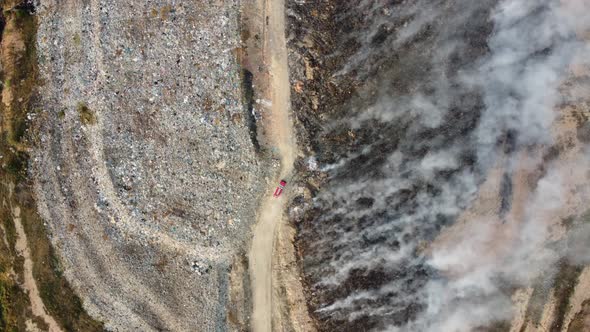 Fire brigade on the way to save fire happen at landfill alt