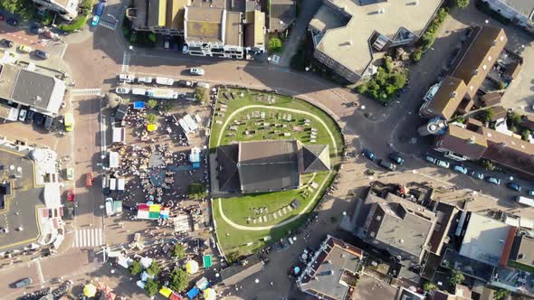 Reformed Church of Wijk aan Zee in the main square with the traditional market, the Netherlands alt