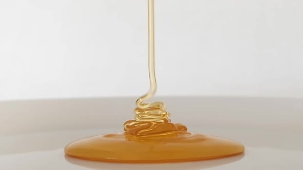 Honey pouring slow motion shooting