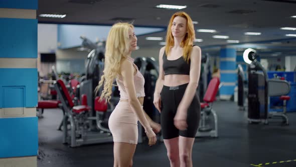 Gorgeous Confident Happy Sportswomen Giving Highfive Smiling Looking at Camera alt