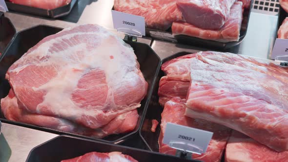 Close Up Appetizing Meat Products Are on Display in Special Containers. Meat Products for Sale in a alt