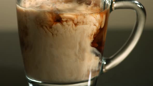Milk poured into coffee in ultra slow motion 1500fps - COFFEE w MILK PHANTOM  alt