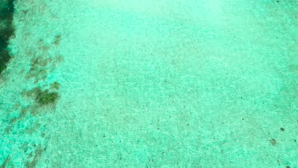 Aerial Footage of a Perfectly Crystal Clear Blue Turquoise Water alt