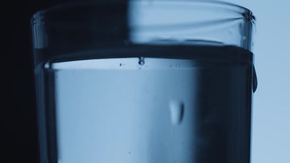 Clean Glass Shots Alcohol Water Tequila Wodka Bubbles on Black White Background alt