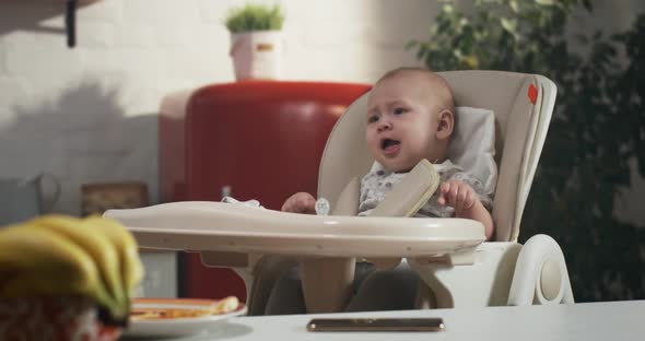 Baby Crying in High Chair alt