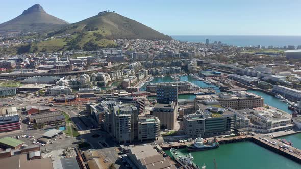 Cape Town harbor district at noon with Lion's head mountain in background