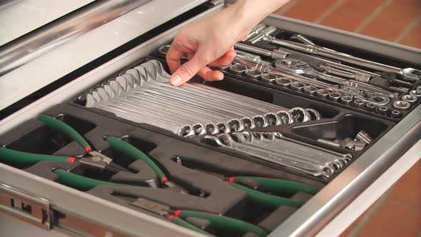 Mechanic Choosing Necessary Tool for Working in Auto Repair Service alt