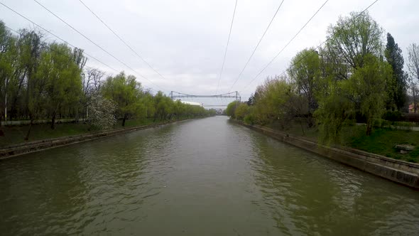 Somes river in Cluj Napoca city center and a cloudy and rainy day alt