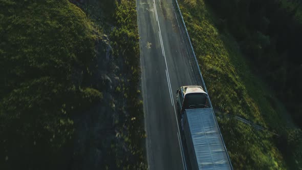 Aerial View of Over Twoline Road with Cargo Truck Lorry Moving to Logistics Center Driving Across alt