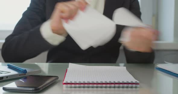 Office  a Woman Reads the Contract Finds a Critical Error and Tears the Paper to Shreds alt