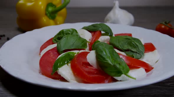 Caprese Salad Dish With Tomatoes And Mozzarella Cheese