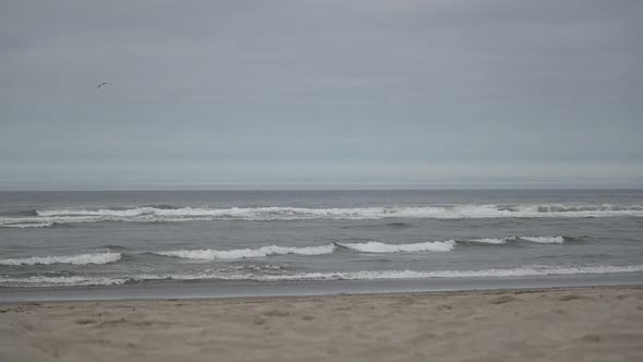 Ocean Waves And Beach On An Overcast Day