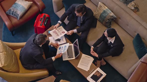 Business Tourists Working in Hotel alt