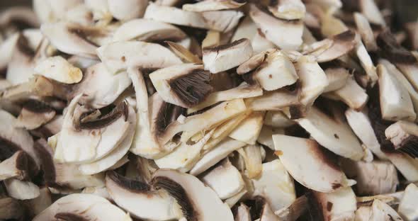 Chef Slicing Mushrooms in Kitchen alt
