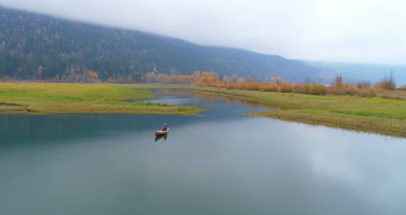 Man Rowing a Boat on A Lake 4k alt